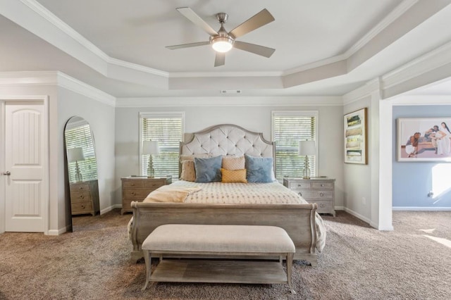 6977 Demeter Dr, Atlanta, GA 30349 - carpeted bedroom featuring a tray ceiling, ornamental molding, baseboards, and a ceiling fan