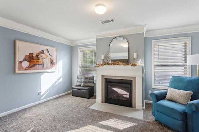 6977 Demeter Dr, Atlanta, GA 30349 - living room with a fireplace with flush hearth, crown molding, carpet flooring, and baseboards