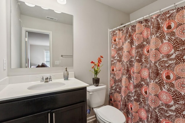 6977 Demeter Dr, Atlanta, GA 30349 - full bathroom featuring toilet and vanity