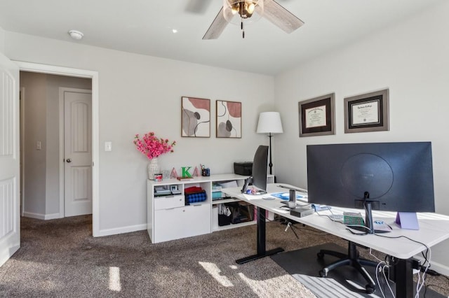 6977 Demeter Dr, Atlanta, GA 30349 - home office featuring ceiling fan, carpet floors, and baseboards