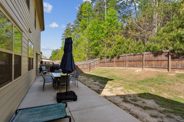 6977 Demeter Dr, Atlanta, GA 30349 - view of patio / terrace featuring a fenced backyard and outdoor dining space