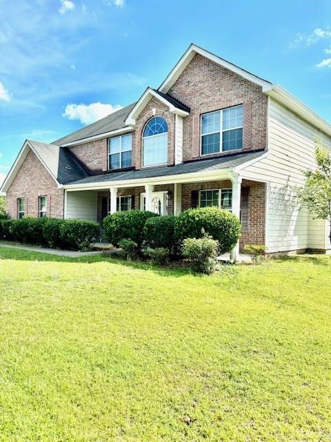 view of front of home with a front yard