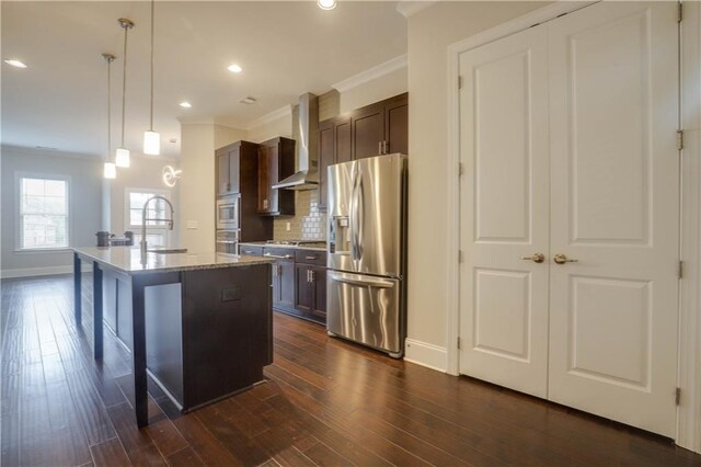 1949 Townsend Ct NE Unit 22, Atlanta, GA 30329 - kitchen with stainless steel appliances, wall chimney exhaust hood, crown molding, a sink, and baseboards