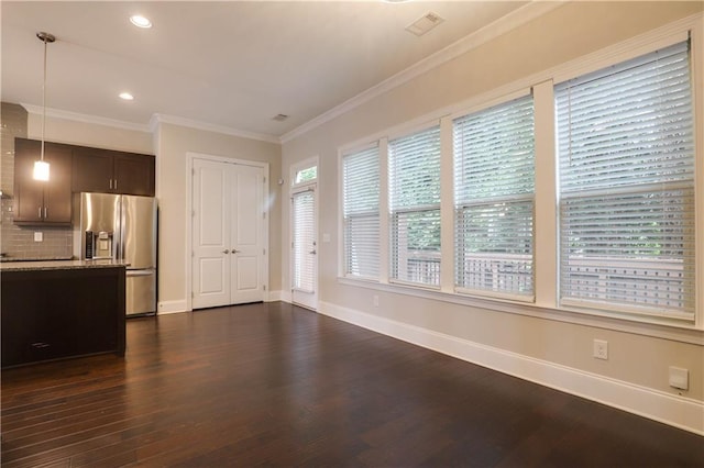 1949 Townsend Ct NE Unit 22, Atlanta, GA 30329 - unfurnished living room featuring dark wood-style flooring, baseboards, recessed lighting, and ornamental molding