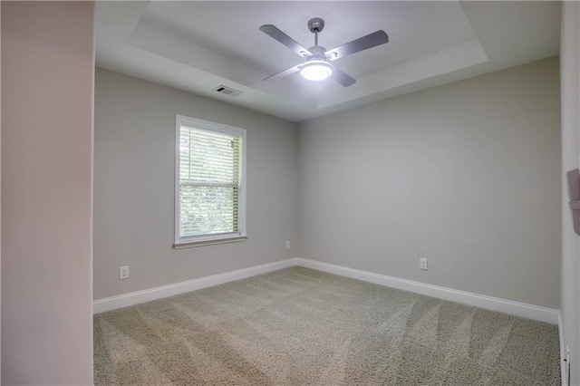 1949 Townsend Ct NE Unit 22, Atlanta, GA 30329 - carpeted spare room featuring baseboards, a tray ceiling, and ceiling fan