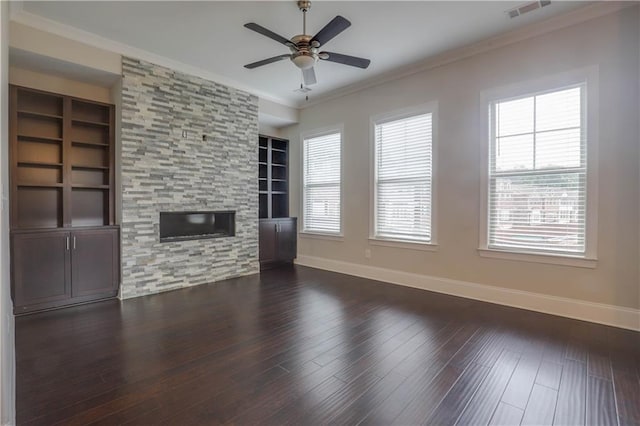 1949 Townsend Ct NE Unit 22, Atlanta, GA 30329 - unfurnished living room with baseboards, ornamental molding, built in shelves, dark wood-type flooring, and ceiling fan