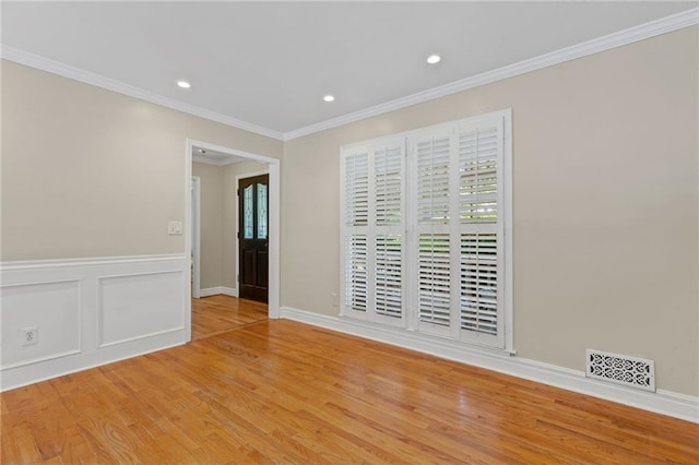 3231 Connemara Trce, Lawrenceville, GA 30044 - spare room with healthy amount of natural light, wood finished floors, crown molding, recessed lighting, and baseboards