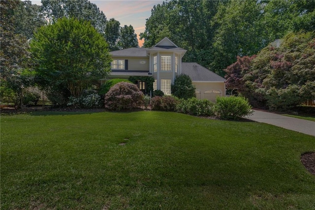 3231 Connemara Trce, Lawrenceville, GA 30044 - view of front of house featuring a front yard, an attached garage, and concrete driveway