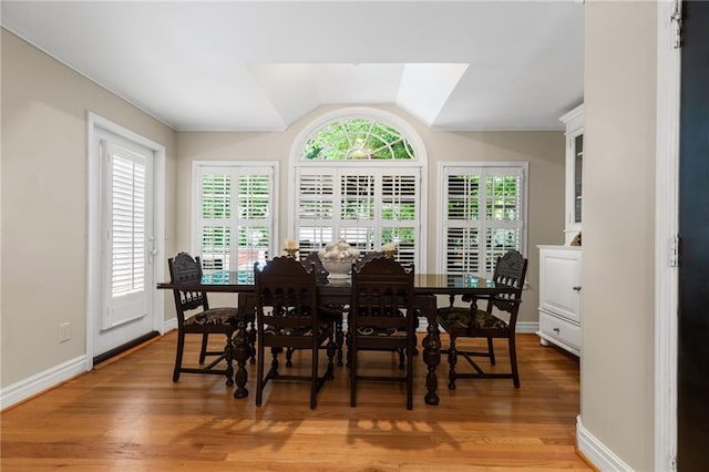 3231 Connemara Trce, Lawrenceville, GA 30044 - dining room with vaulted ceiling, light wood-type flooring, and baseboards
