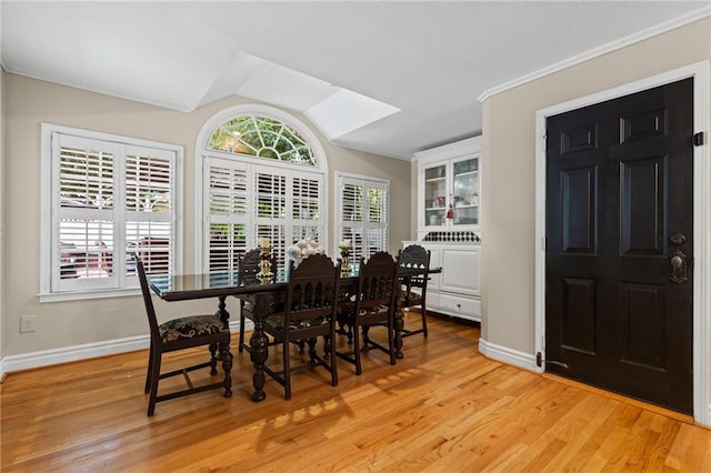 3231 Connemara Trce, Lawrenceville, GA 30044 - dining space featuring baseboards, light wood-style flooring, and vaulted ceiling