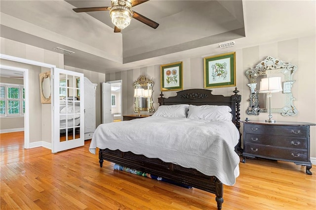 3231 Connemara Trce, Lawrenceville, GA 30044 - bedroom with a raised ceiling, wood finished floors, baseboards, and a ceiling fan