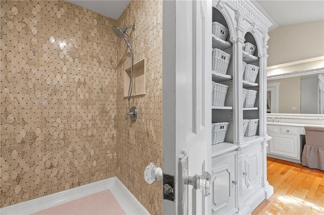 3231 Connemara Trce, Lawrenceville, GA 30044 - full bathroom with a tile shower, vanity, and wood finished floors