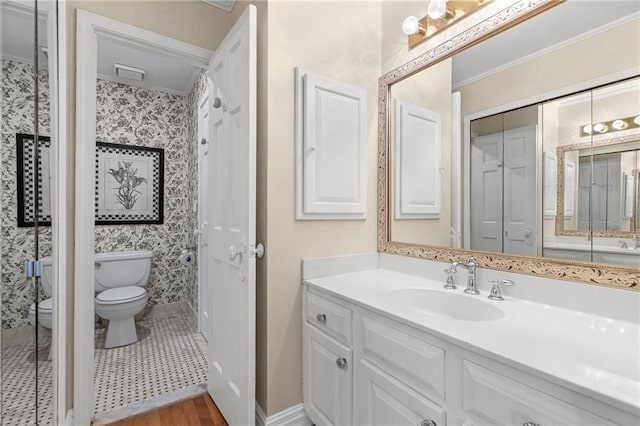 3231 Connemara Trce, Lawrenceville, GA 30044 - full bath featuring toilet, vanity, wood finished floors, crown molding, and baseboards