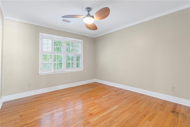 3231 Connemara Trce, Lawrenceville, GA 30044 - spare room with light wood finished floors, baseboards, ceiling fan, and crown molding