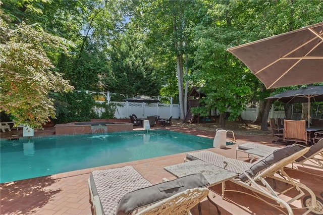 3231 Connemara Trce, Lawrenceville, GA 30044 - view of swimming pool featuring an outdoor hot tub, a fenced backyard, and a patio