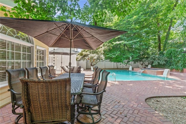 3231 Connemara Trce, Lawrenceville, GA 30044 - fenced backyard featuring a patio area, a hot tub, and outdoor dining area