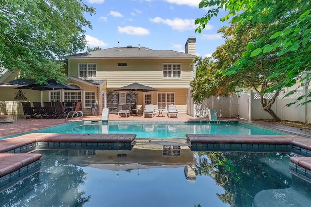 3231 Connemara Trce, Lawrenceville, GA 30044 - view of swimming pool with a pool with connected hot tub and a patio