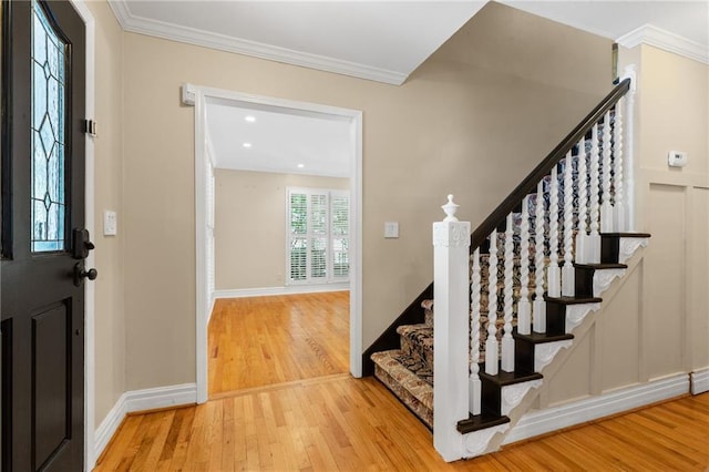 3231 Connemara Trce, Lawrenceville, GA 30044 - foyer with hardwood / wood-style flooring, stairway, crown molding, and baseboards