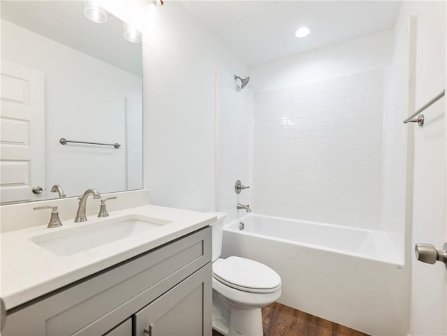 full bathroom featuring vanity, shower / bath combination, wood finished floors, and toilet