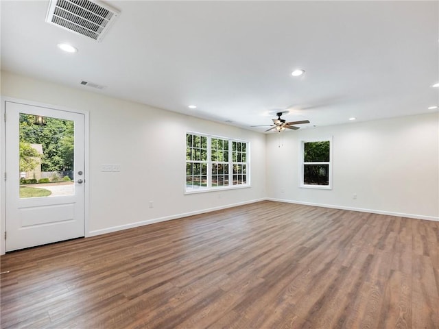 interior space with wood finished floors, visible vents, and recessed lighting