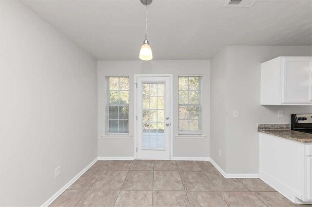 116 Rolling Meadows Ct, Hampton, GA 30228 - unfurnished dining area with light tile patterned floors