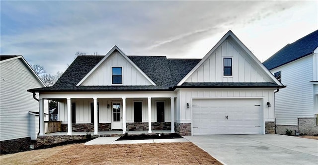 view of front of property with a garage and a porch