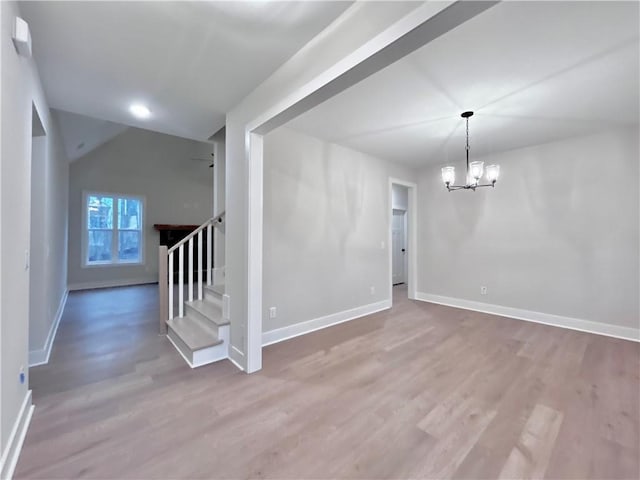 interior space with an inviting chandelier and hardwood / wood-style flooring