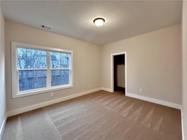 empty room featuring carpet flooring