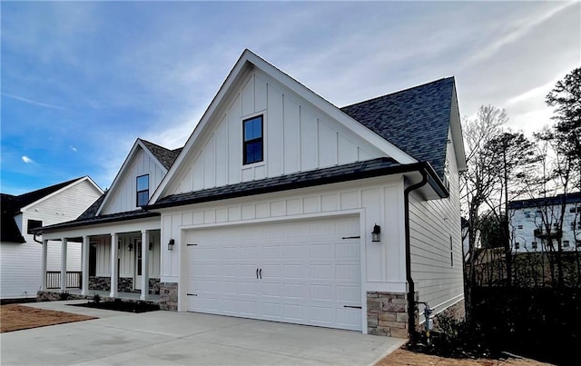 view of front of property featuring a garage and covered porch