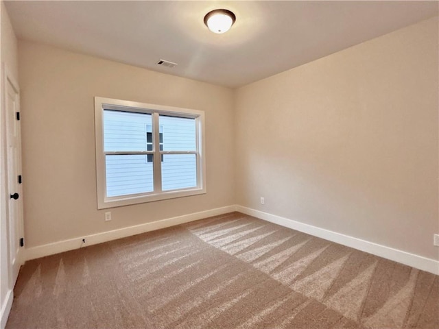 spare room featuring carpet flooring