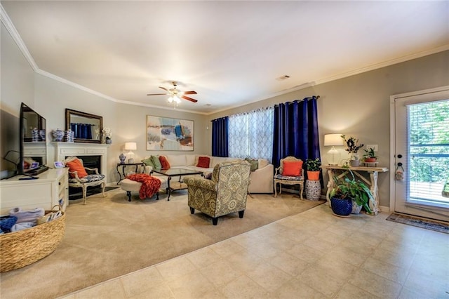 345 Piedmont Cir, Covington, GA 30016 - living room featuring crown molding, a fireplace, a ceiling fan, tile patterned floors, and baseboards