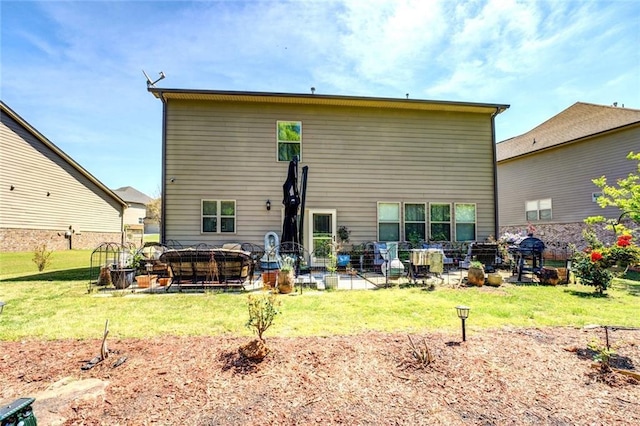 345 Piedmont Cir, Covington, GA 30016 - rear view of house featuring a hot tub, a lawn, and a patio area