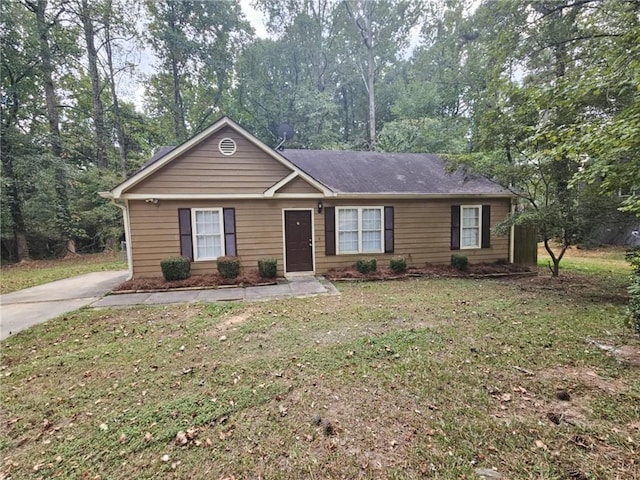 single story home with a front lawn