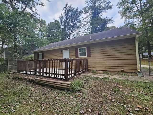 back of property featuring a deck