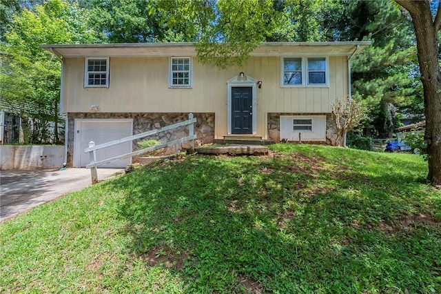 2242 Cherokee Valley Cir, Lithonia, GA 30058 - split foyer home with concrete driveway, an attached garage, stone siding, and a front lawn