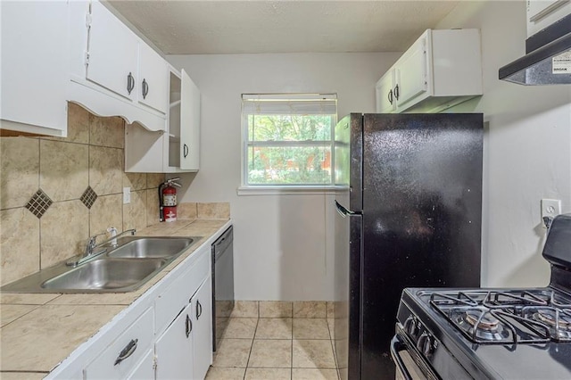 2242 Cherokee Valley Cir, Lithonia, GA 30058 - kitchen featuring exhaust hood, gas range oven, backsplash, and white cabinetry