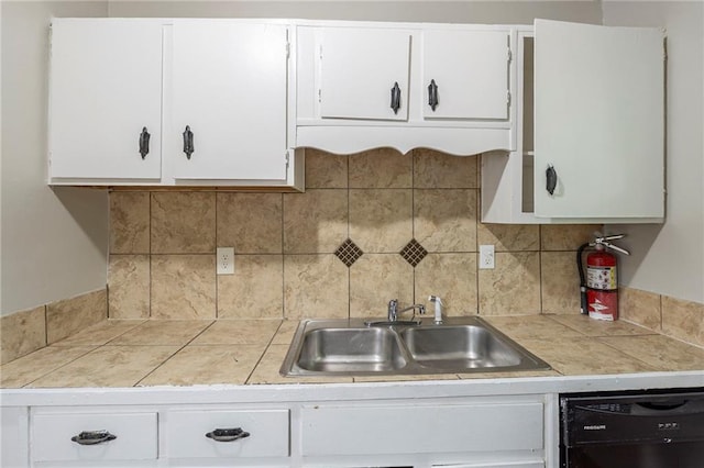 2242 Cherokee Valley Cir, Lithonia, GA 30058 - kitchen featuring black dishwasher, white cabinets, decorative backsplash, and tile countertops