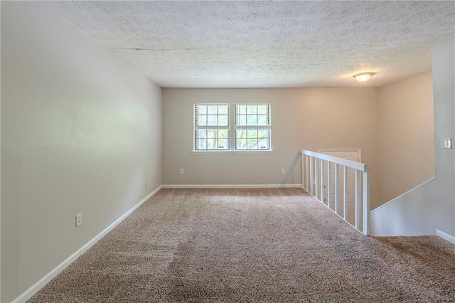 2242 Cherokee Valley Cir, Lithonia, GA 30058 - carpeted spare room with a textured ceiling and baseboards