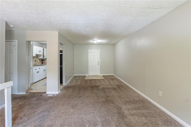 2242 Cherokee Valley Cir, Lithonia, GA 30058 - spare room with light carpet and a textured ceiling