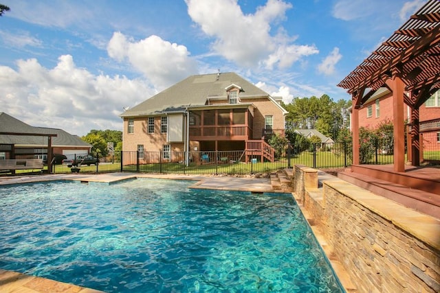 view of pool with a sunroom