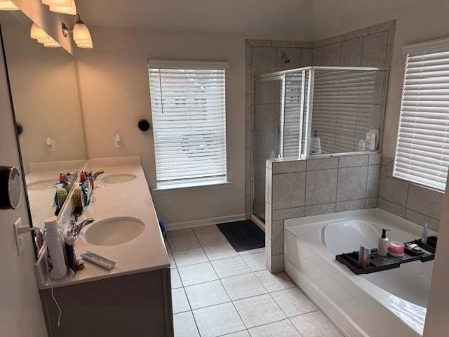 bathroom featuring vanity, plenty of natural light, shower with separate bathtub, and tile patterned floors