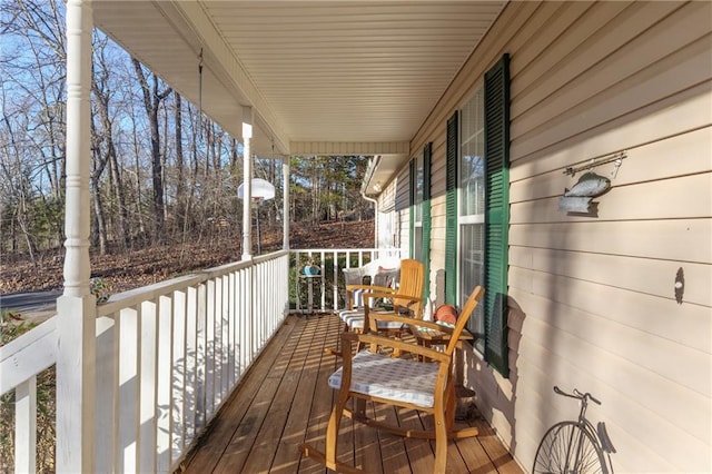 wooden terrace featuring covered porch