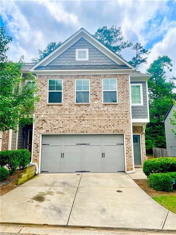 4353 Morning Vw, Stone Mountain, GA 30083 - view of front facade featuring brick siding, a garage, and concrete driveway