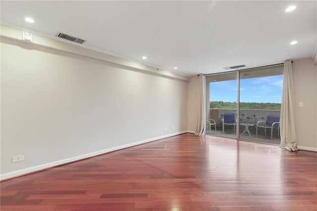1501 Clairmont Rd Unit 1522, Decatur, GA 30033 - empty room with wood finished floors, recessed lighting, and expansive windows