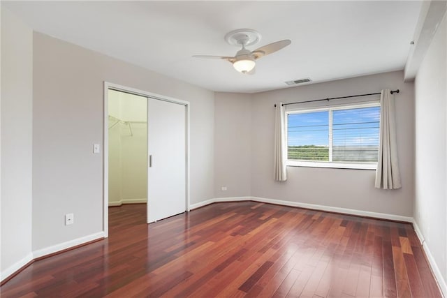 1501 Clairmont Rd Unit 1522, Decatur, GA 30033 - unfurnished bedroom with wood finished floors, a closet, and a ceiling fan