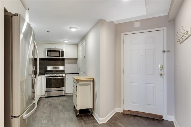 1501 Clairmont Rd Unit 1522, Decatur, GA 30033 - kitchen featuring appliances with stainless steel finishes, white cabinets, and light countertops