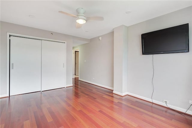1501 Clairmont Rd Unit 1522, Decatur, GA 30033 - unfurnished bedroom featuring wood finished floors, a closet, and a ceiling fan