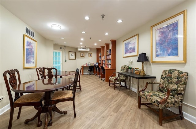 1501 Clairmont Rd Unit 1522, Decatur, GA 30033 - dining room featuring light wood-style flooring, recessed lighting, and a wall mounted AC