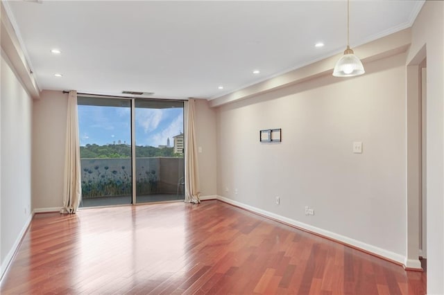 1501 Clairmont Rd Unit 1522, Decatur, GA 30033 - spare room featuring wood finished floors, crown molding, recessed lighting, and floor to ceiling windows