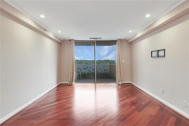 1501 Clairmont Rd Unit 1522, Decatur, GA 30033 - spare room with wood finished floors, ornamental molding, recessed lighting, and a wall of windows
